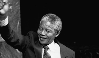  Nelson Mandela, Deputy President of the African National Congress of South Africa, raises his fist in the air while addressing the Special Committee Against Apartheid in the General Assembly Hall. 22 June 1990 