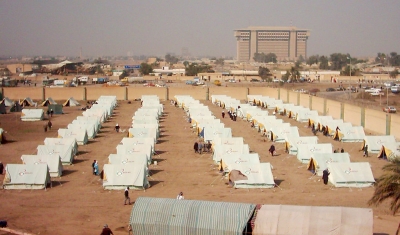 A tent camp erected in Baghdad’s eastern Al-Shaab stadium to shelter Internally Displaced Persons (IDPs). The Interior Ministry building is seen in the background.
