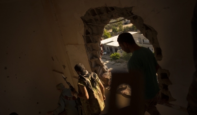 Libya, Fighters are seen in a house during an attack against militants. 