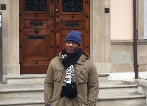 Tafadzwa Christmas, a Zimbabwean student enrolled in the Master of Advanced Studies in Transitional Justice, Human Rights and the Rule of Law in front of the Villa Moynier, the Geneva Academy's headquarters