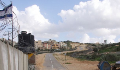 West Bank, Qalqilya, enclaved village of Azun Atme. Azun Atme check-point and West Bank barrier between Beit Amin and the settlement of Sha'arei Tikva