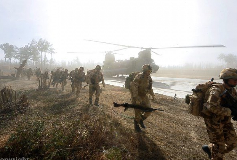 Soldiers file away after disembarking a Royal Air Force Chinook helicopter during Operation Banbarac 3 in Afghanistan.