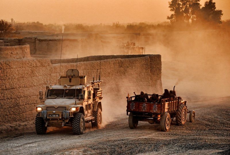 UK Troops in Husky Vehicle Pass Local Civilians on Route Trident in Afghanistan