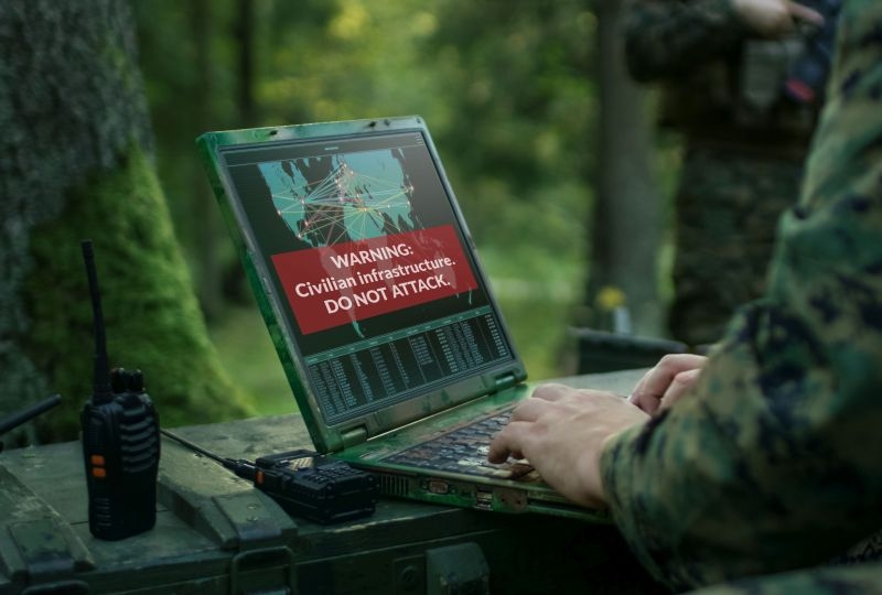 Soldier typing on a computer