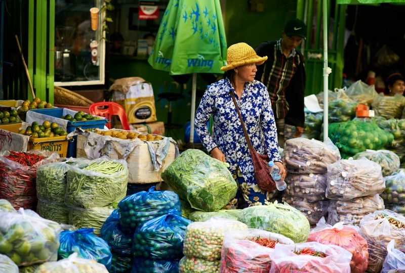 A woman sells fruits in a Cambodian market