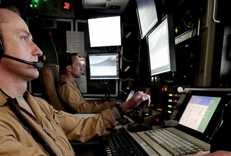 Crewmen from 39 Squadron, Royal Air Force, are pictured at the controls of a Reaper UAV (Unmmaned Aerial Vehicle) from a control cabin at Kandahar Airfield, Afghanistan.