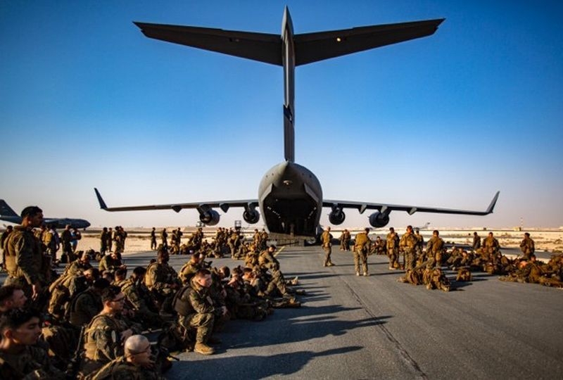Evacuation at Hamid Karzai International Airport, Marines assigned to the 24th Marine Expeditionary Unit (MEU) await a flight at Al Udeied Air Base, Qatar August 17. Marines are assisting the Department of State with an orderly drawdown of designated personnel in Afghanistan.