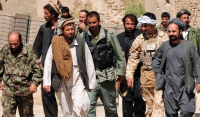 Taliban insurgents turn themselves in to Afghan National Security Forces at a forward operating base in Puza-i-Eshan. Their defections come in the midst of Operation Taohid II, and Afghan-led operation designed to defeat the insurgency