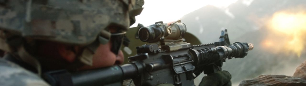A U.S. Army Soldier with 1st Battalion, 32nd Infantry Regiment, 10th Mountain Division, fires an M-4 rifle during a gun battle with insurgent forces in Barge Matal, during Operation Mountain Fire, July 12. 