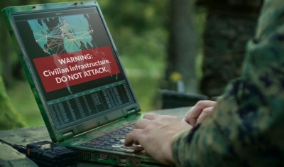 A military types on a computer